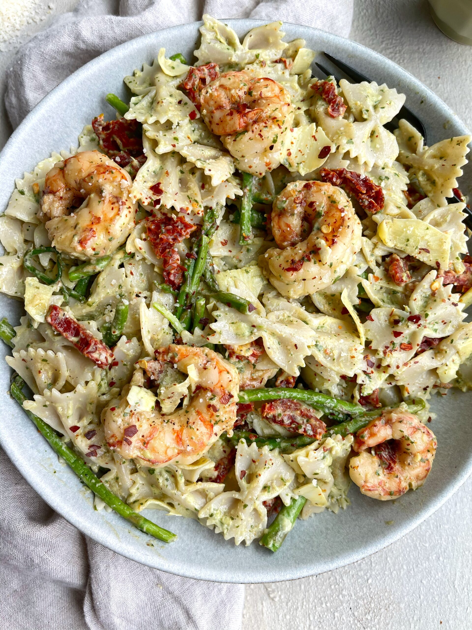 image of shrimp asparagus pasta dish  in glass cookware